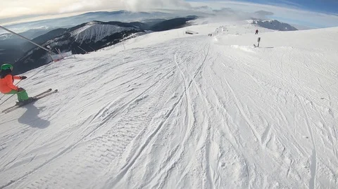 Snowboarder slopes down hill. Action camera is on snowboarder's helmet Stock Footage 120096443
