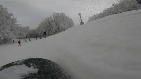 Snowboarder slopes down hill.Shadow of snowboarder. Stock Footage 123316640
