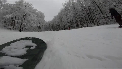 Snowboarder slopes down hill.Shadow of snowboarder. Stock Footage 123316656