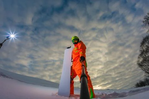 Snowboarder with the snowboard making a selfie Stock Photos