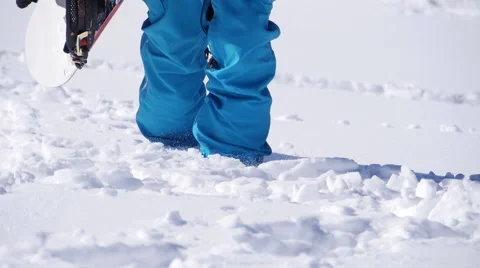 Snowboarder Stepping Through Deep Snow Video stock 56645405
