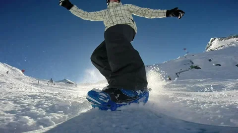 Snowboarder on track in alpine mountains Stock Footage