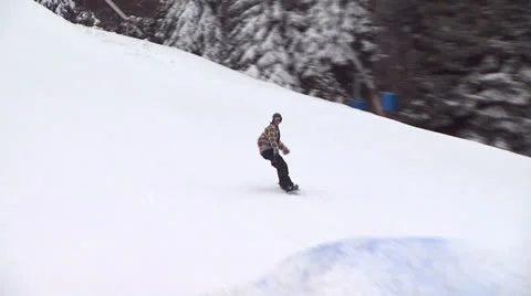 Snowboarder Trying Out a Trick Stock Footage 26067571