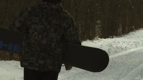 Snowboarder Walking Stock Footage 1042201