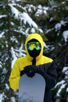 Snowboarder in a yellow jacket Stock-Fotos