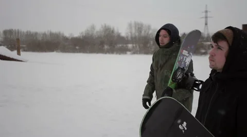 Snowboarders go somewhere Stock Footage 64508194