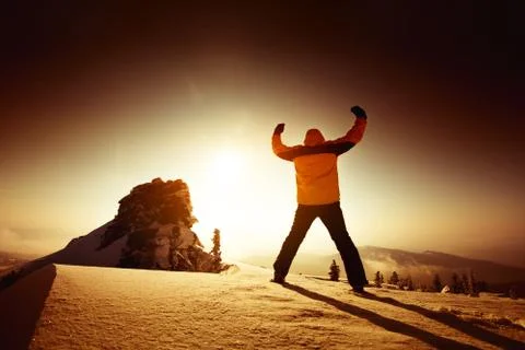 Snowboarders posing on blue sky backdrop in mountains 스톡 사진