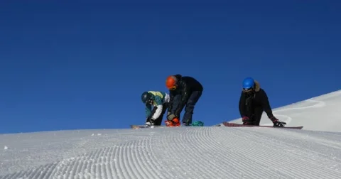 Snowboarders Strapping In 4k Stock Footage 48466991