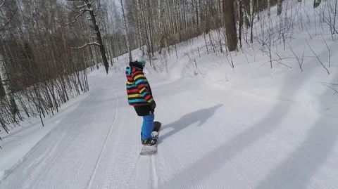 Snowboarding Between The Trees Stock Footage 99139963