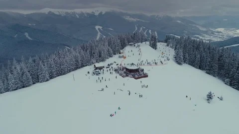 Snowboarding freeride winter drone flight in mountains nea cafe, elevator and Stock Footage 85396296