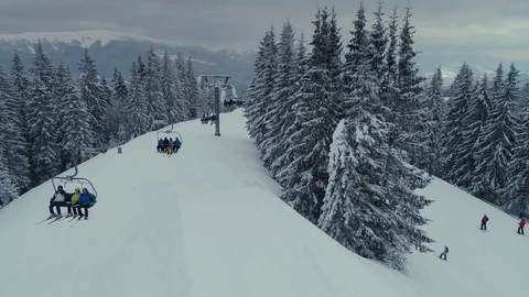 Snowboarding freeride winter drone flight in mountains nea cafe, elevator and Видео 85396638