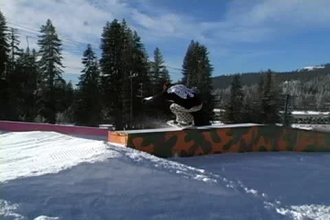 Snowboarding jumps and rails Stock Footage 10702292