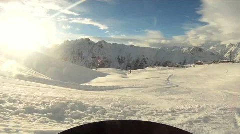 Snowboarding sideways into the sun Stock Footage 1160662