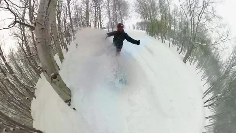 Snowboarding through deep powder face shot of snow in Colorado vail mountains Stock Footage 102671244