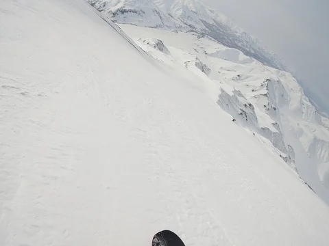Snowboarding in wild mountains Stock Footage 92596752