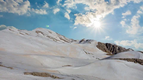 Snowbound mountain ridge under a sparkle sun Stock-Footage 259073790
