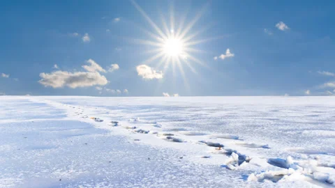 Snowbound plain with human track at sunny winter day Stock-Footage 257606456