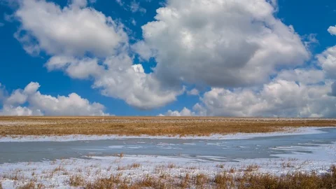Snowbound prairie under a flying clouds Video stock 120253919