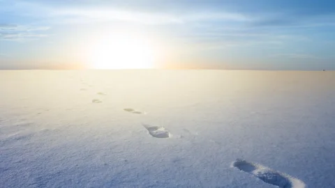 Snowbound winter plain with human track at the sunset Stock Footage 249151664