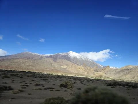 Snowcapped mountain landscape under clear blue sky Stock Photos