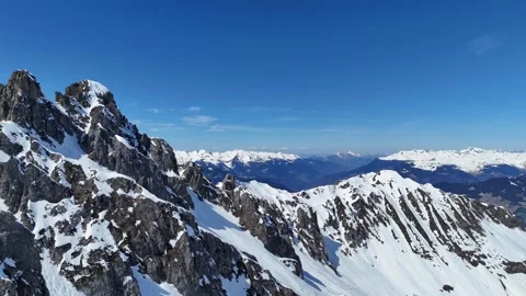 Snowcapped mountain peak by winter in  Courchevel ski resort, French alps Stock Footage 334327479