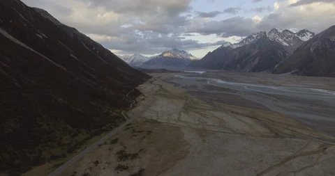 Snowcapped mountain range and glacial valley with Mount Cook in background Stock Footage 119157486