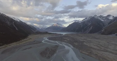 Snowcapped mountain range with Mount Cook and glacial valley at dusk Stock Footage 119157339