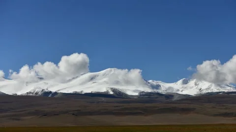 Snowcapped mountains and clouds at Ukok Plateau Stock Footage 143462143