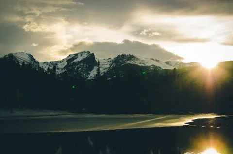 Snowcapped mountains at sunset. Stock Photos
