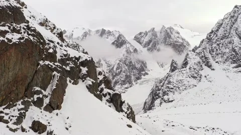 Snowcapped mountains with winter valley. Stock Footage 306286062