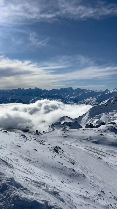 Snowcapped summit of 3 Valley, 3200m under the clouds by winter Stock Footage 334405061