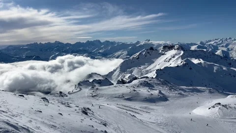 Snowcapped summit of 3 Valley, 3200m under the clouds by winter Stock Footage 334405126