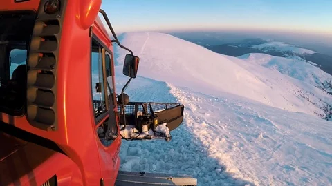 Snowcat going up the snowy mountain. Stock Footage 106329553