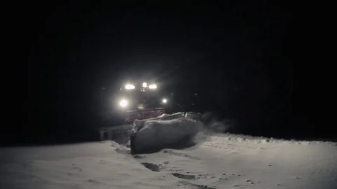 Snowcat preparing a slope at night in high mountains at skiing resort Stock Footage 76150734