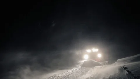 Snowcat preparing a slope at night in high mountains at skiing resort Stock Footage 76150784