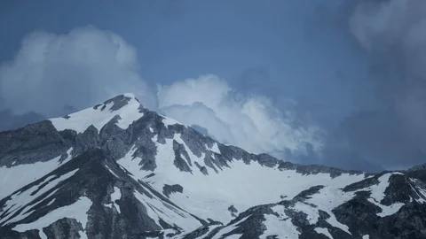 SnowCovered Mountains And Clouds Timelapse 4k Video stock 87639926