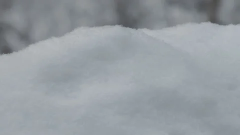 A snowdrift grows during a snowfall, a timelapse close-up Stock Footage 166669492