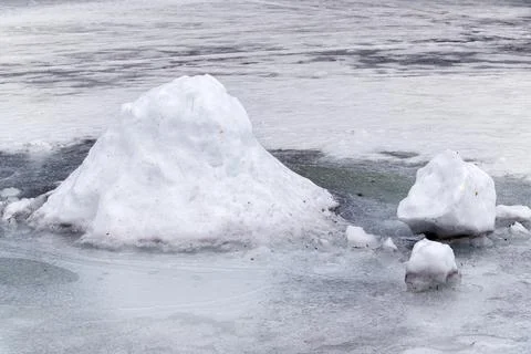 Snowdrift on ice. Stock Photos