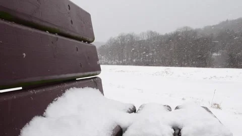Snowed in park bench close up Stock Footage 262379507