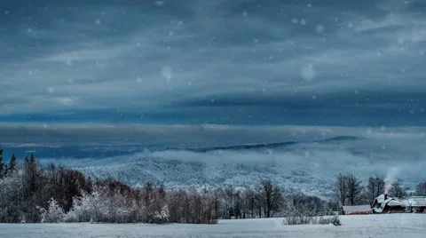 Snowfall above the hut in the mountains Video stock 60616916