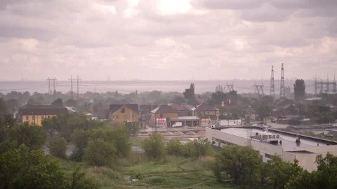 Snowfall and heavy rain in summer. In background are green trees, grass, path. Stock Footage 111471089