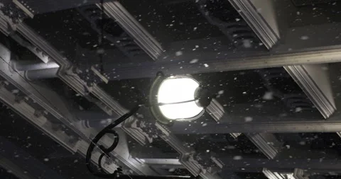 Snowfall and a street light at night in winter. Snowflakes illuminated by bright Stock Footage 258226692