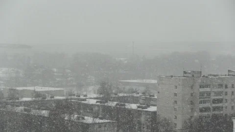 Snowfall on the background of the city. Stock Footage 127079631