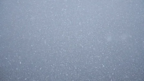 Snowfall on the background of the lake. Winter gray abstract landscape with snow Stock Footage 83341339