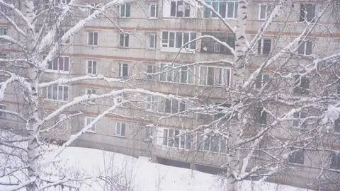 Snowfall on the background of white brick house Stock Footage 170423749