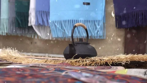 Snowfall Beginning on Oriental Carpet Laid in Garden Stock Footage 330275304