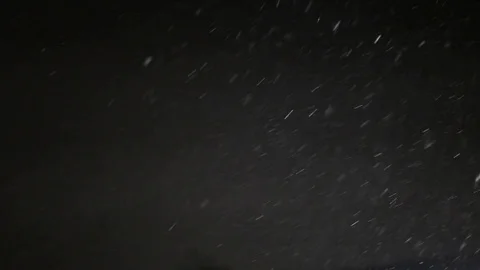 Snowfall on black background Stock Footage 102863012