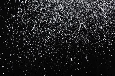Snowfall on black background Foto stock