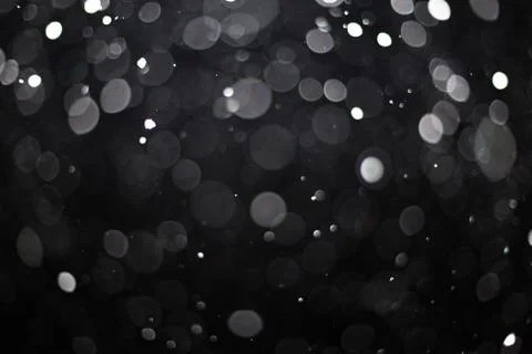 Snowfall on black background Stock Photos