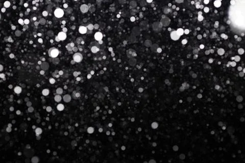 Snowfall on black background Stock Photos